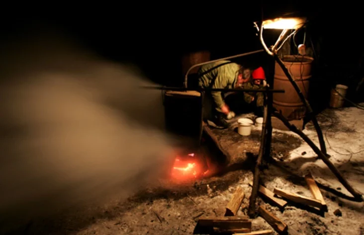 A villager produces moonshine vodka. Photo by Julia Darashkevich