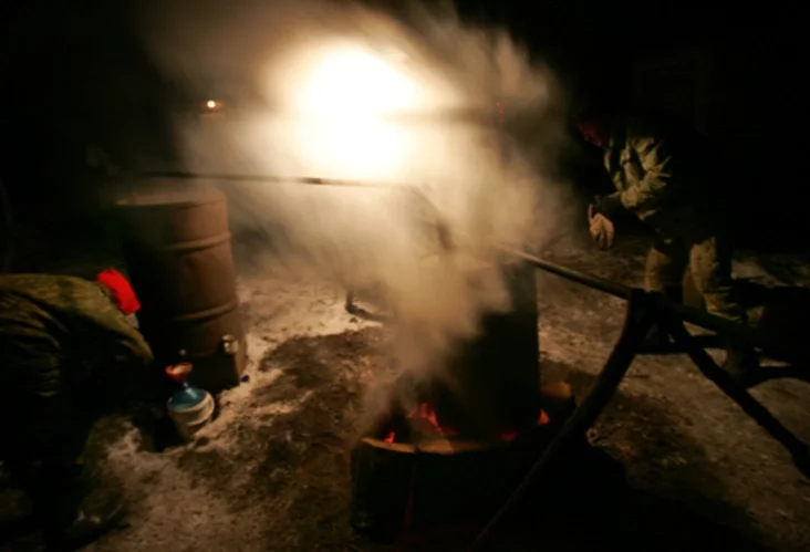 A villager produces moonshine vodka. Photo by Julia Darashkevich